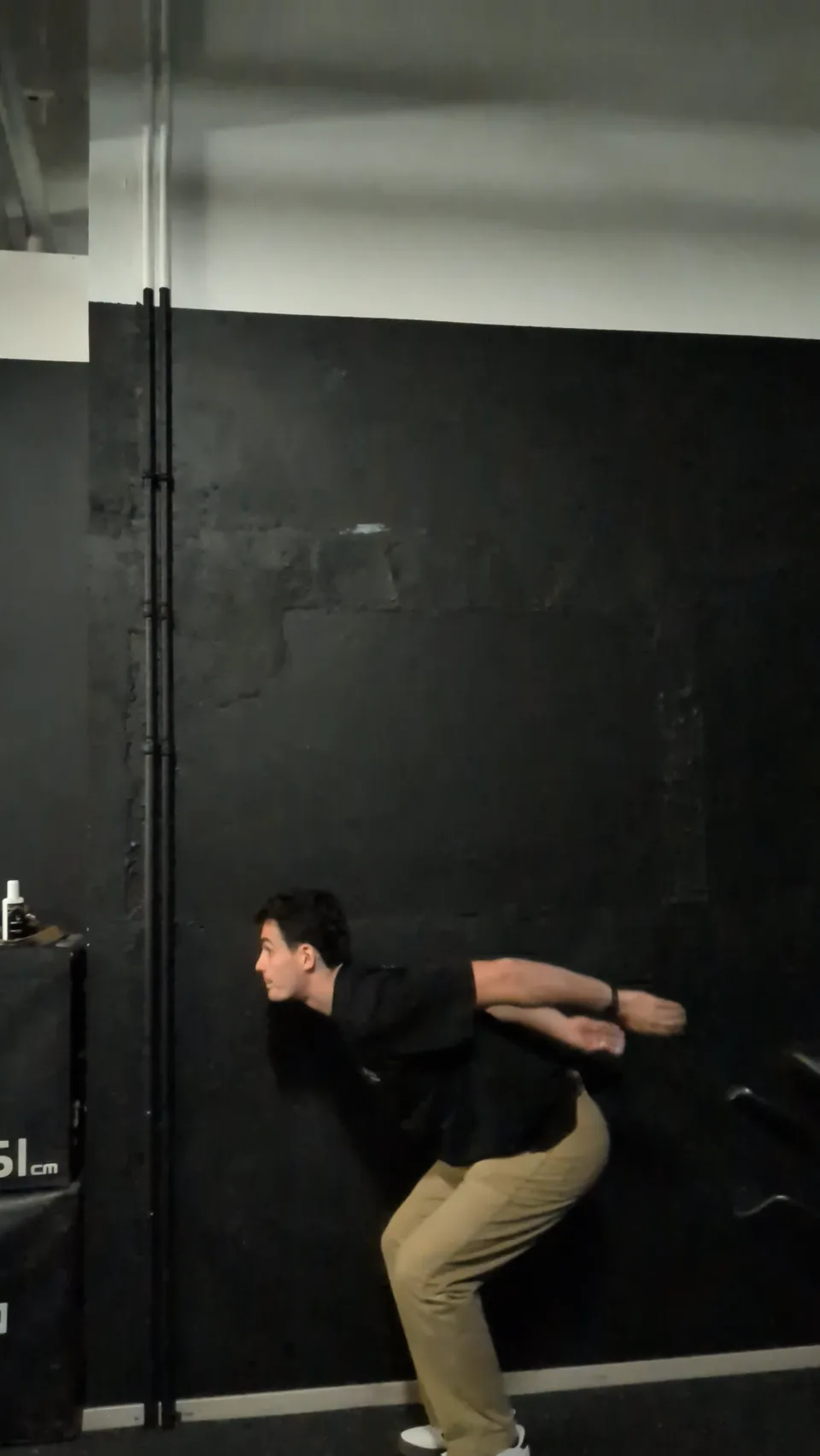 Dipping into a countermovement with arms swung back before the jump
